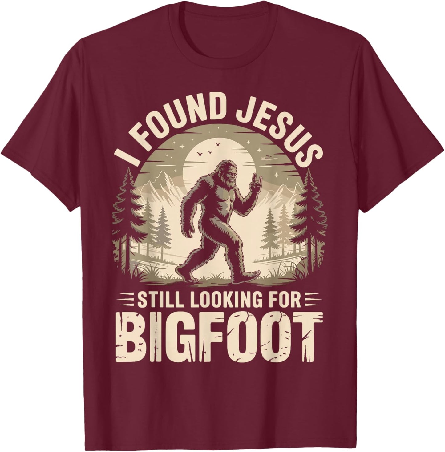 I Found Jesus Still Looking for Bigfoot Funny T-Shirt - T-Shirt | Maroon