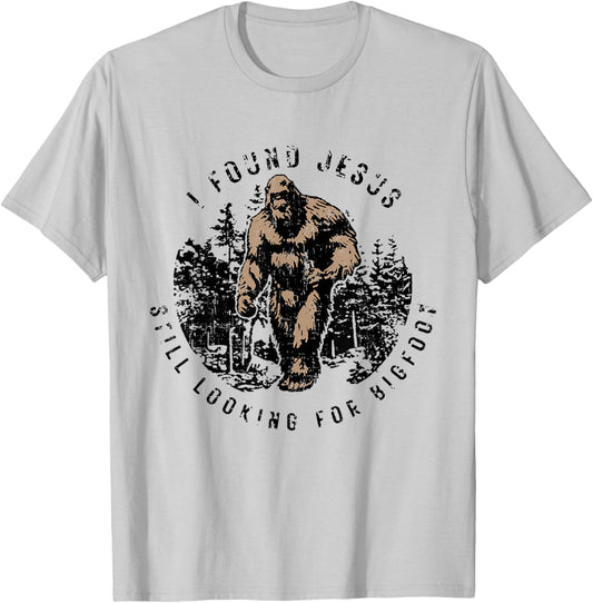 I Found Jesus Still Looking Bigfoot Funny Christian T-Shirt - T-Shirt | Ash